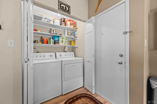an aerial view of a house with outdoor space and a lake view