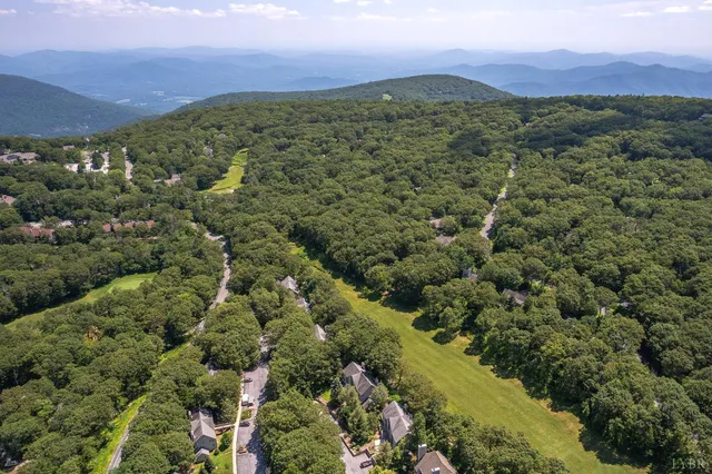 a view of a city with mountains in the background