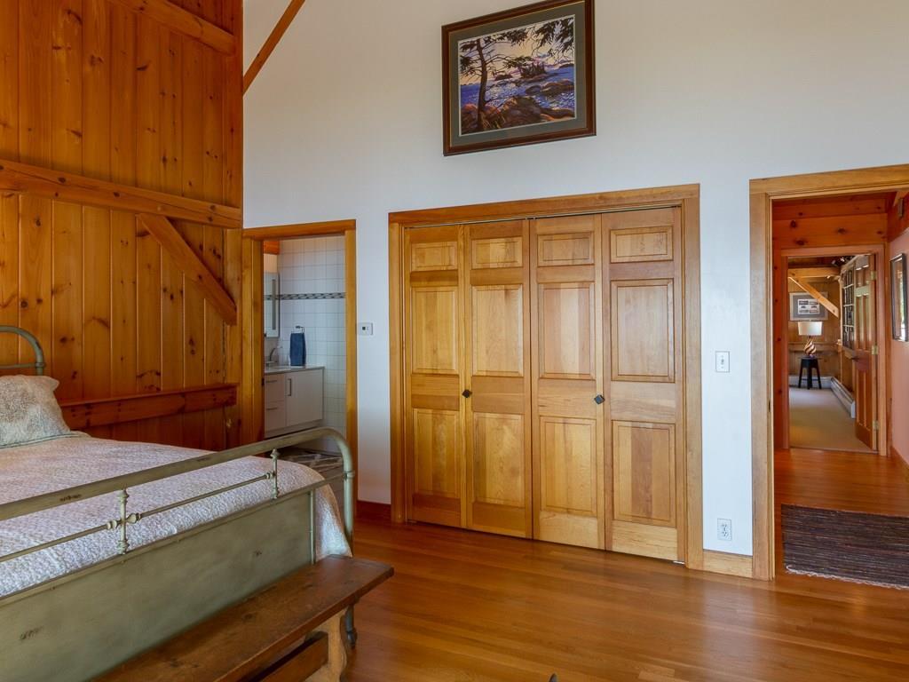 506 Newbury Neck Road Surry, ME 04684 - Photo 16 of 35 The master bedroom has a private...