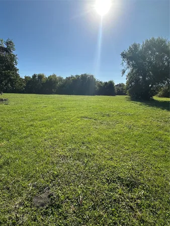a view of a lake from a yard