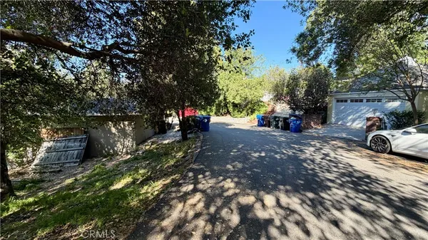 a view of street with parked cars