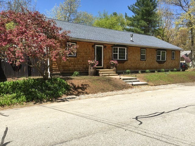 43 Ridge Way Sturbridge, MA 01566 - Photo 1 of 22 a front view of house with yard and trees around
