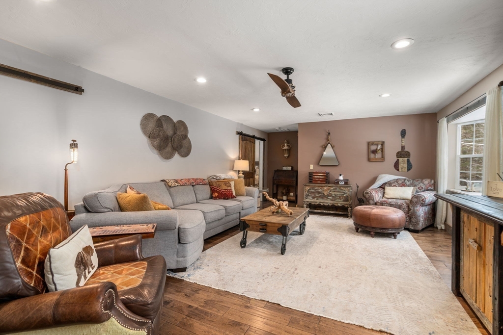 43 Ridge Way Sturbridge, MA 01566 - Photo 11 of 22 a living room with furniture and a large window