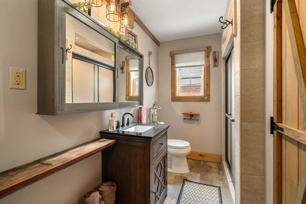 43 Ridge Way Sturbridge, MA 01566 - Photo 13 of 22 a bathroom with a granite countertop sink toilet and mirror