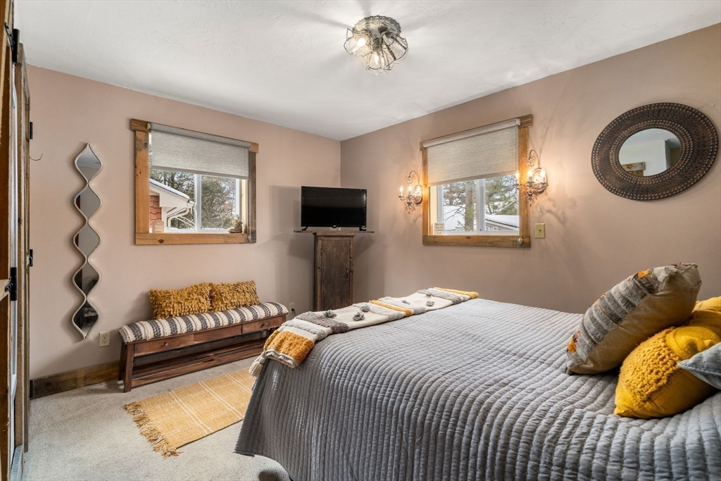 43 Ridge Way Sturbridge, MA 01566 - Photo 14 of 22 a bedroom with a bed and dresser