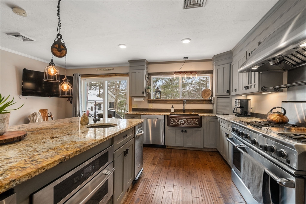 43 Ridge Way Sturbridge, MA 01566 - Photo 2 of 22 a kitchen with a sink stove and wooden floor