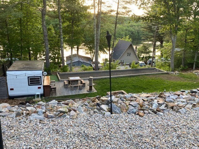 43 Ridge Way Sturbridge, MA 01566 - Photo 21 of 22 a view of a chairs and fire pit in the backyard