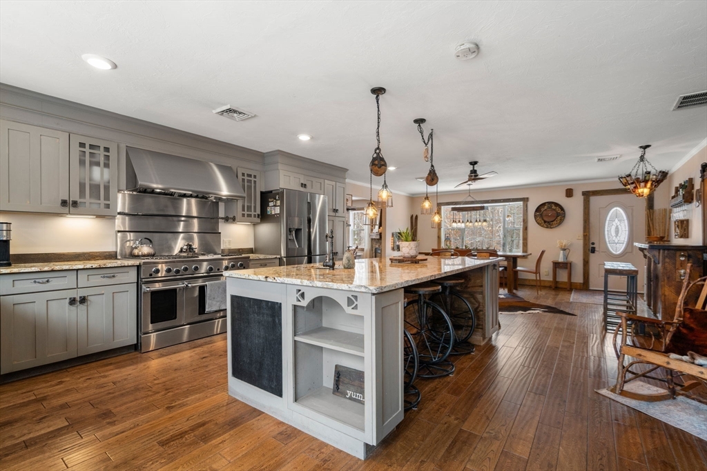43 Ridge Way Sturbridge, MA 01566 - Photo 5 of 22 a kitchen with stainless steel appliances granite countertop a stove and cabinets