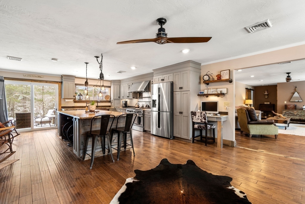 43 Ridge Way Sturbridge, MA 01566 - Photo 6 of 22 a view of a dining room with furniture and wooden floor