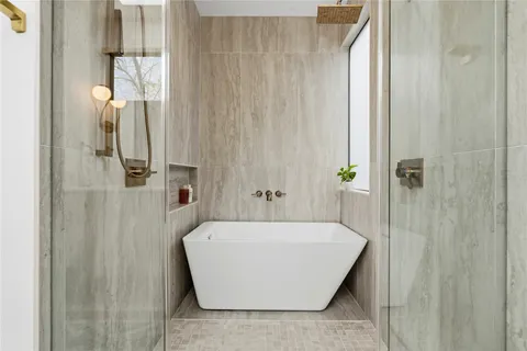 a bathroom with a toilet and a shower curtain