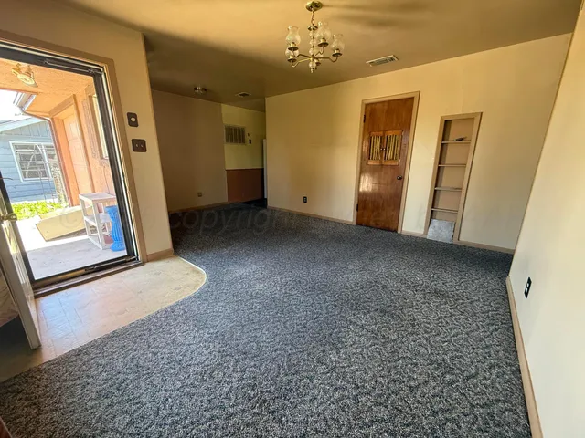 a view of livingroom with hardwood floor and windows
