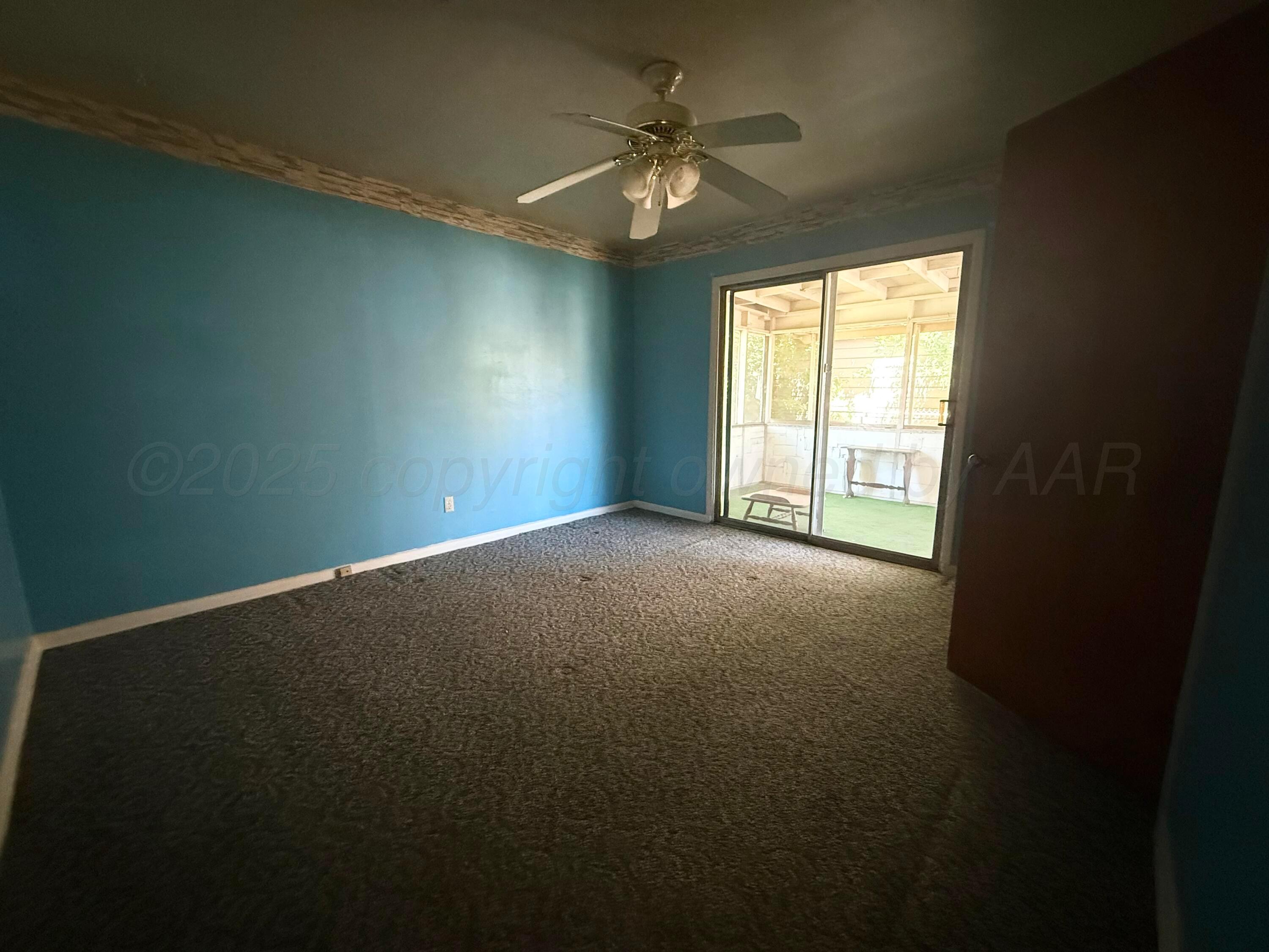 1030 Thrams Street Borger, TX 79007 - Photo 6 of 9 a view of an empty room with a window