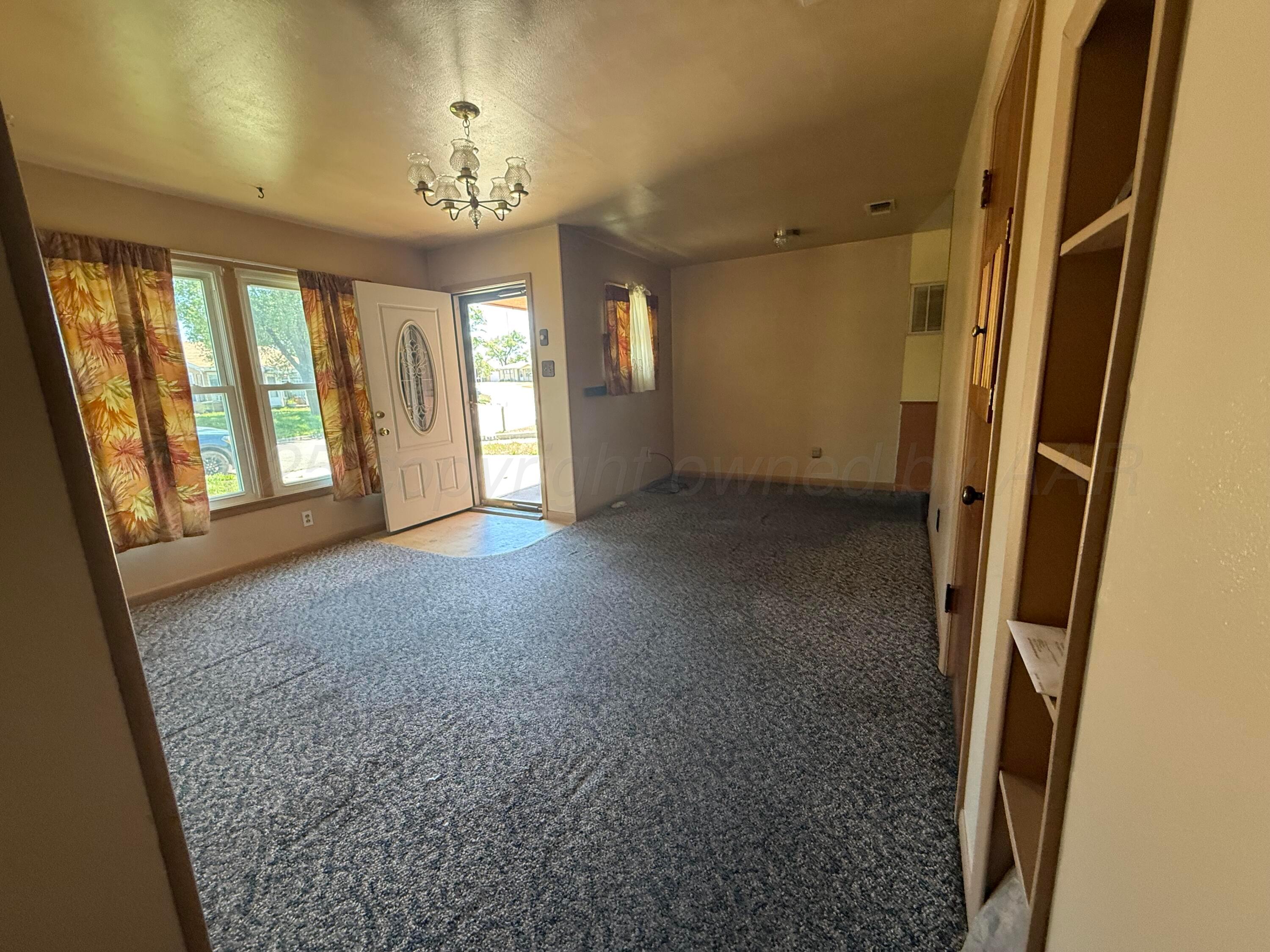 1030 Thrams Street Borger, TX 79007 - Photo 8 of 9 an empty room with windows