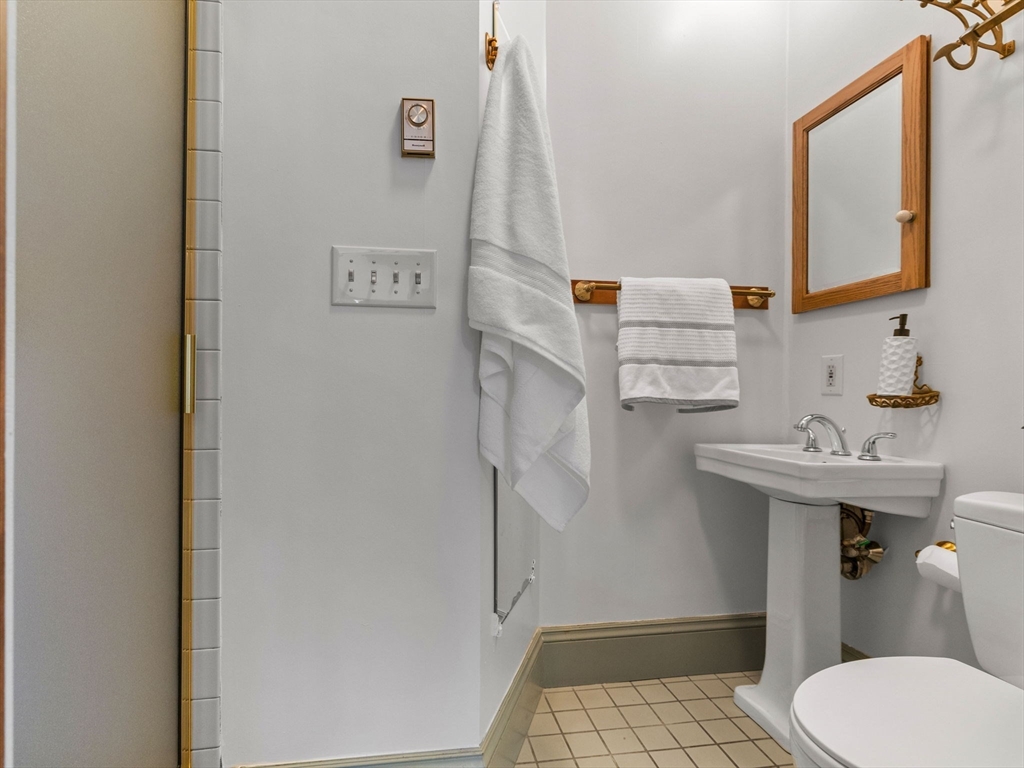 82 Perkins Street Boston, MA 02130 - Photo 11 of 31 a bathroom with a sink toilet and mirror