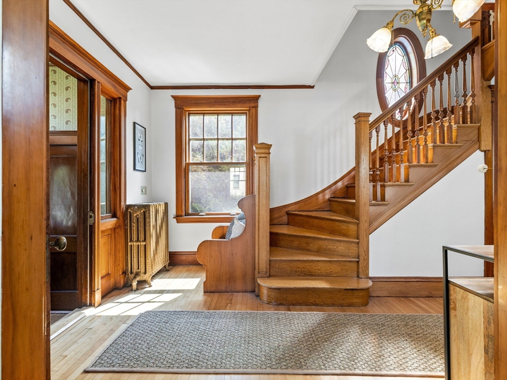 82 Perkins Street Boston, MA 02130 - Photo 12 of 31 a view of entryway and hall with wooden floor