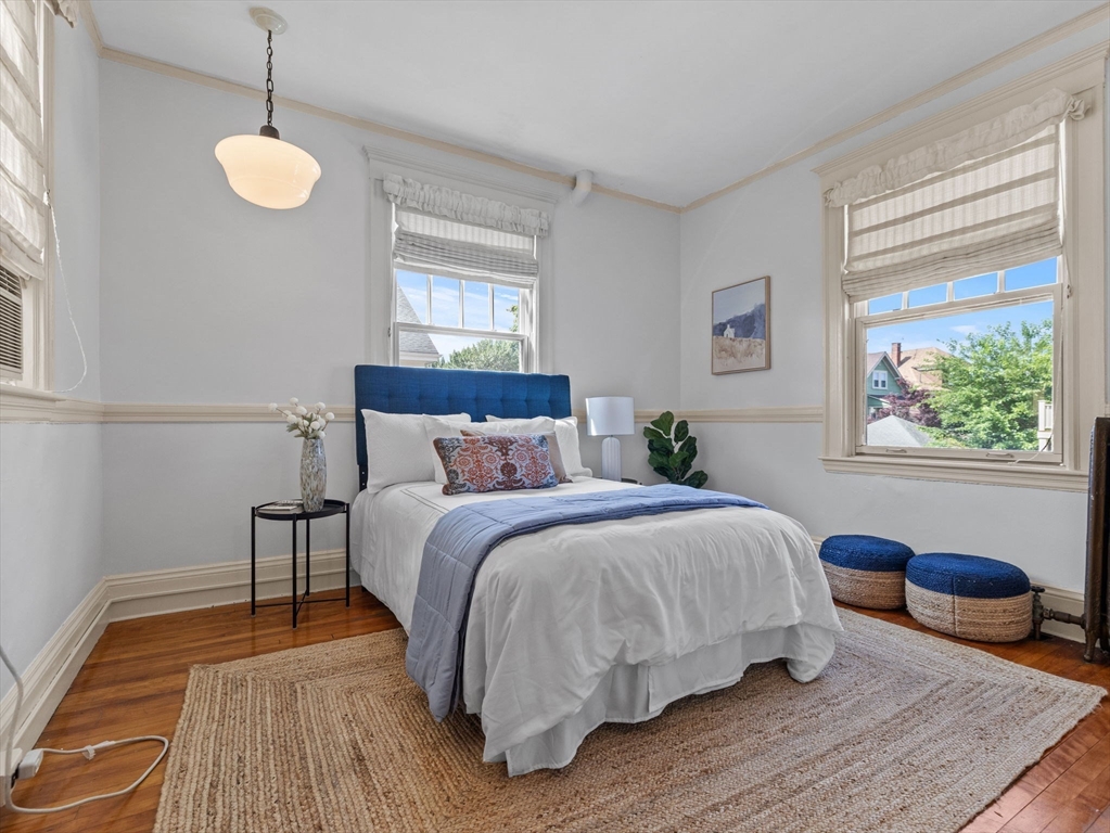 82 Perkins Street Boston, MA 02130 - Photo 14 of 31 a bedroom with a bed and a window