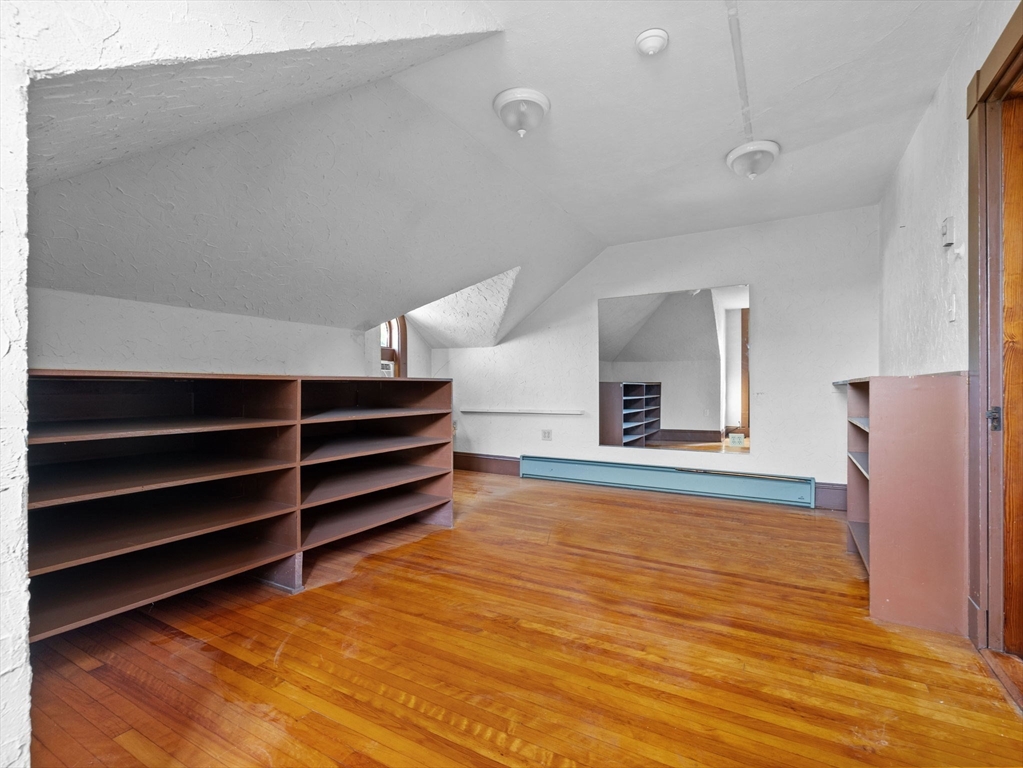 82 Perkins Street Boston, MA 02130 - Photo 19 of 31 a view of room and wooden floor