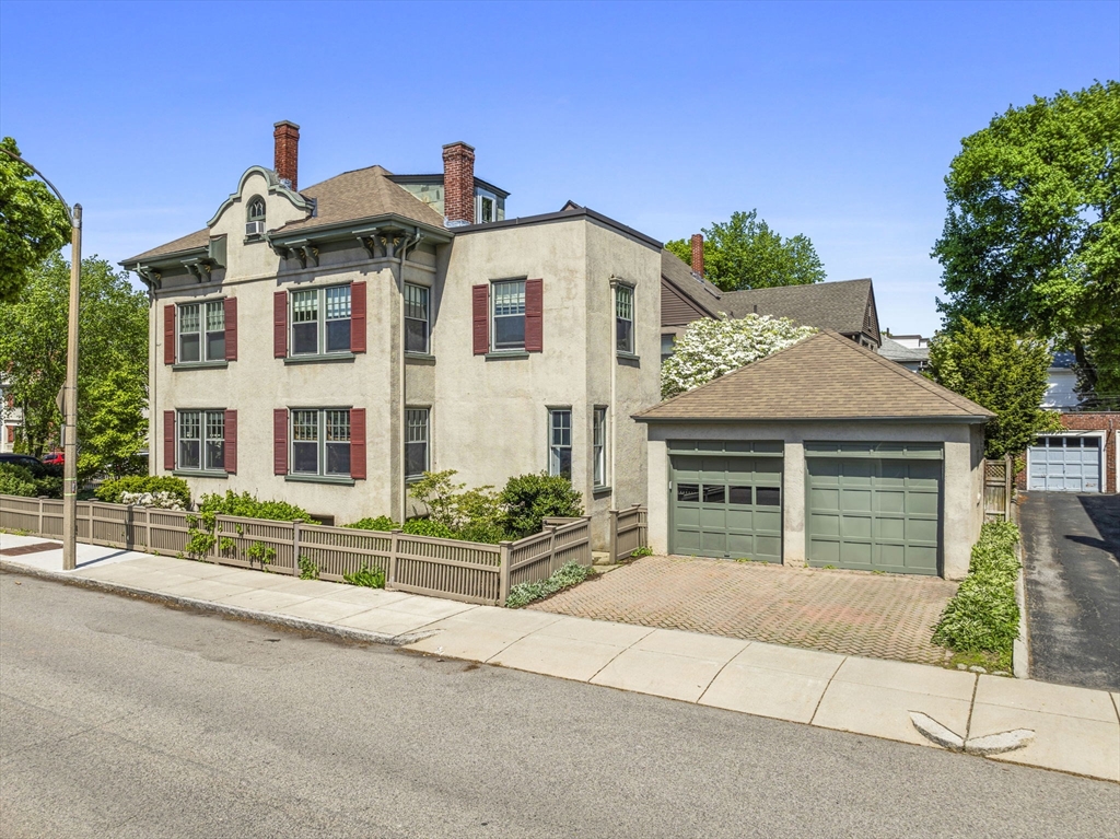 82 Perkins Street Boston, MA 02130 - Photo 31 of 31 a front view of a house with a garden