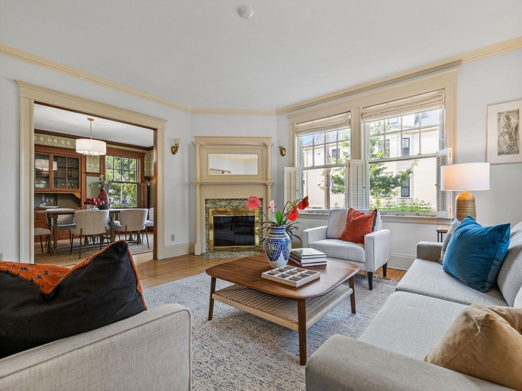 82 Perkins Street Boston, MA 02130 - Photo 5 of 31 a living room with furniture fireplace and a table