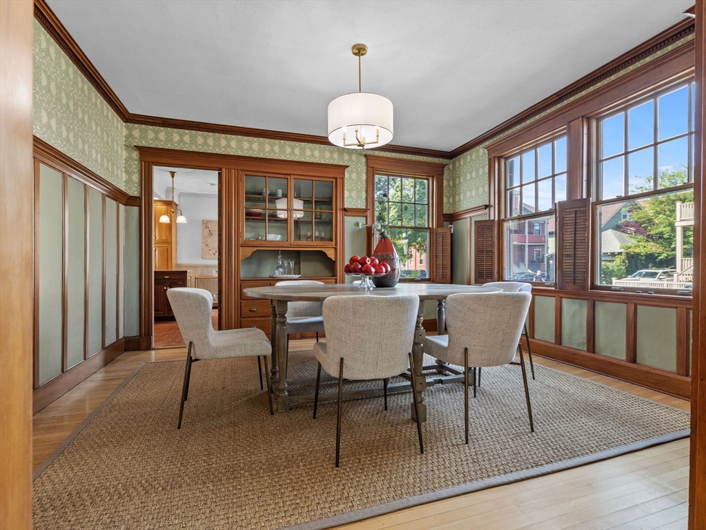 82 Perkins Street Boston, MA 02130 - Photo 6 of 31 a dining room with furniture a chandelier and wooden floor