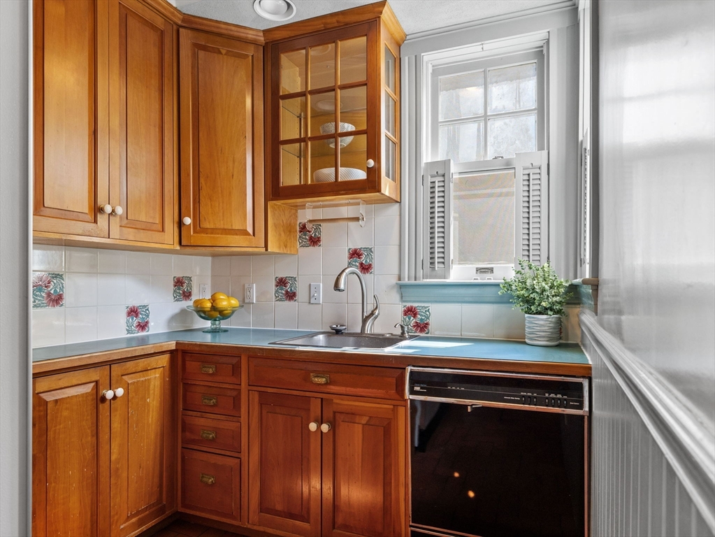 82 Perkins Street Boston, MA 02130 - Photo 10 of 31 a kitchen with stainless steel appliances granite countertop a sink stove and cabinets