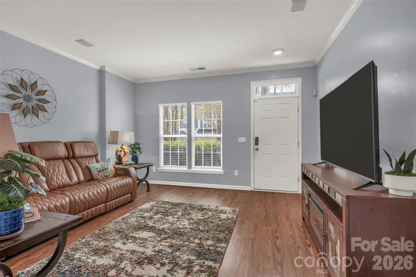 a kitchen with a sink granite counter tops and a window