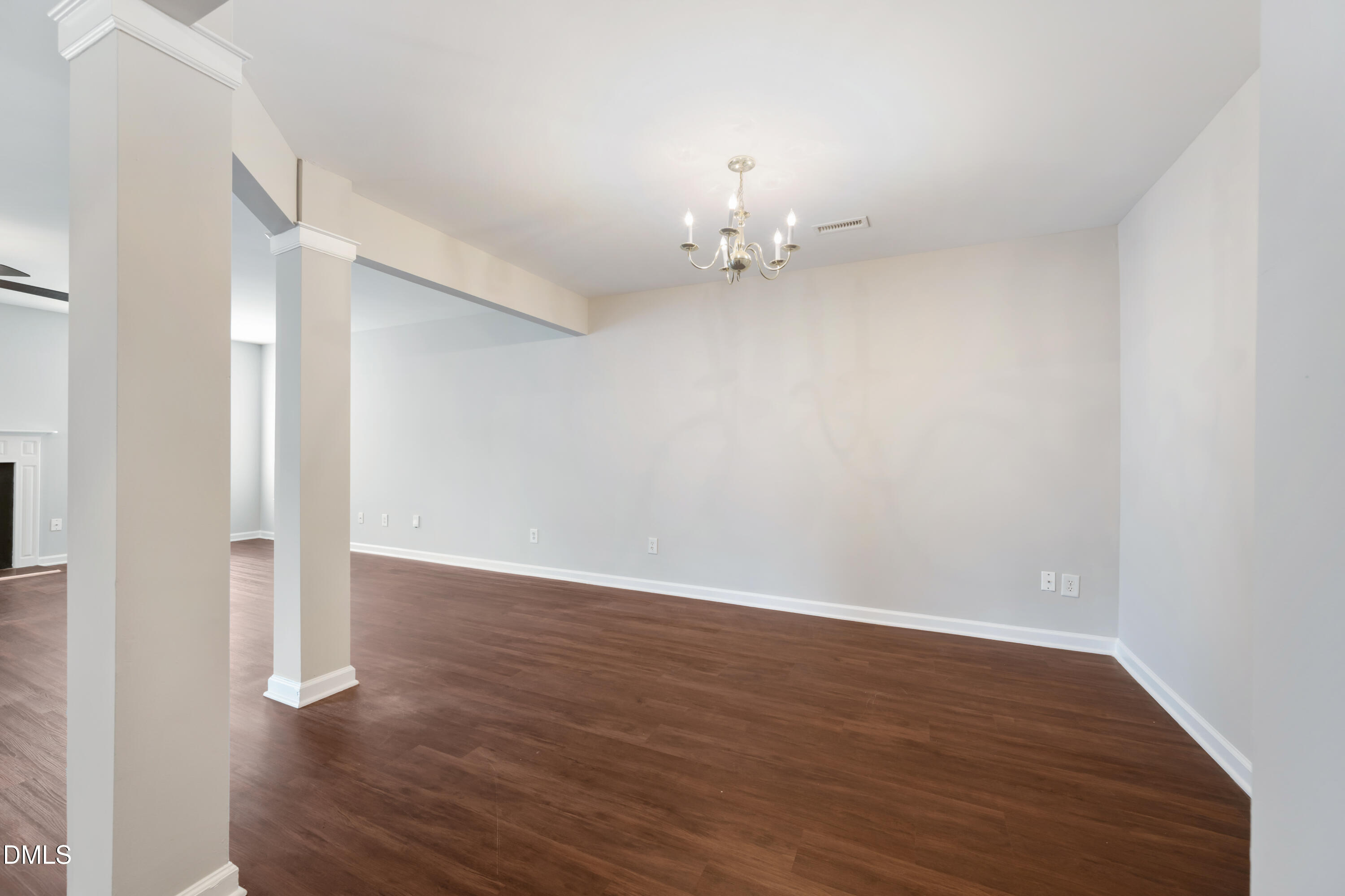 1532 Pebble Ridge Drive Raleigh, NC 27610 - Photo 15 of 40 a view of an empty room with wooden floor
