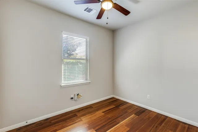 a room with window and wooden floor