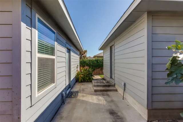 a view of house with backyard and garden