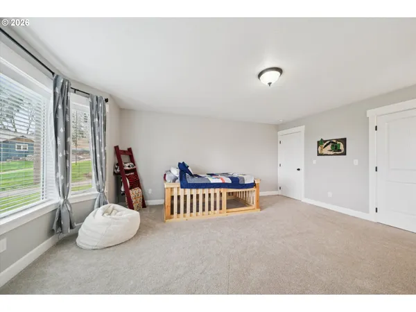 a view of a room with furniture and windows