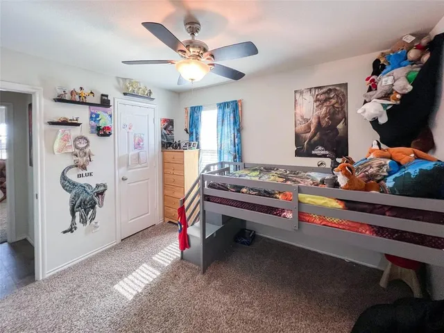 a room with lots of white furniture and window