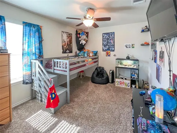 a bedroom with furniture and a chandelier