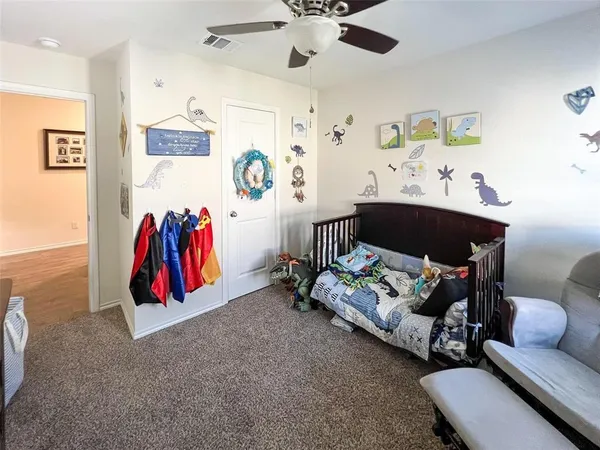 a living room with furniture and a baby