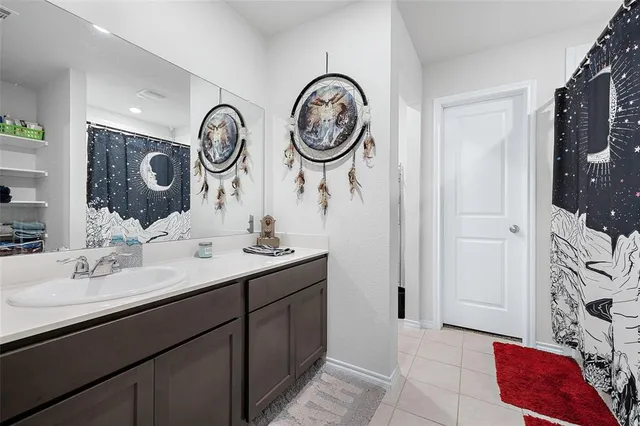 a bathroom with a two sink and a mirror