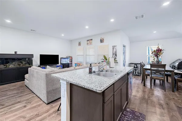 a kitchen with a table and chairs in it