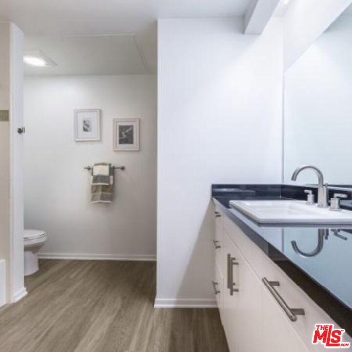 245 Pine Avenue, Unit 224 Long Beach, CA 90802 - Photo 10 of 15 a view of a bathroom with a sink and a toilet