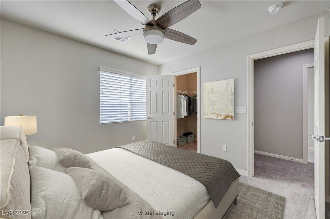 5697 Graystone Ridge Avenue Las Vegas, NV 89141 - Photo 11 of 60 upstairs bedroom 2 with walkin closet virtually staged