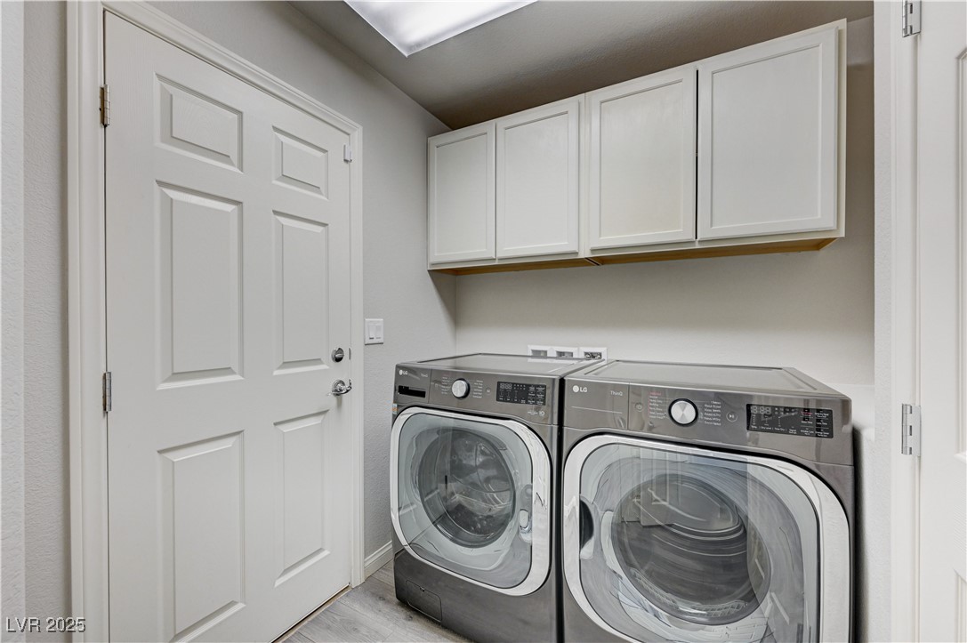 5697 Graystone Ridge Avenue Las Vegas, NV 89141 - Photo 19 of 60 Garage entry, cabinets and more storage not in view