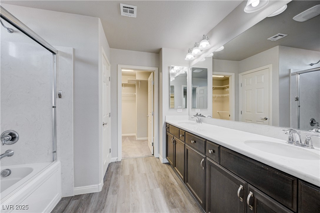 5697 Graystone Ridge Avenue Las Vegas, NV 89141 - Photo 8 of 60 Primary bathroom, dual sinks, Shower/tub combo and large walk-in closet