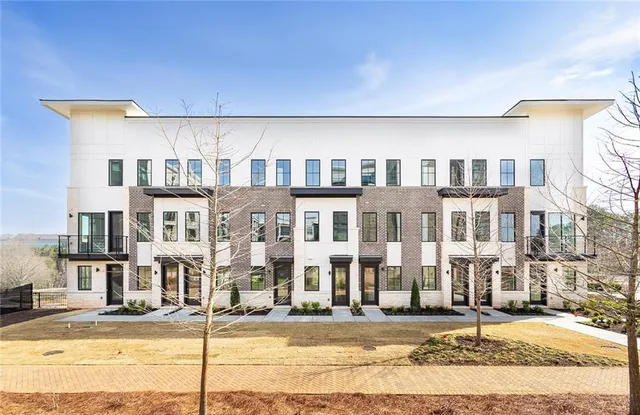 a front view of a building with a street