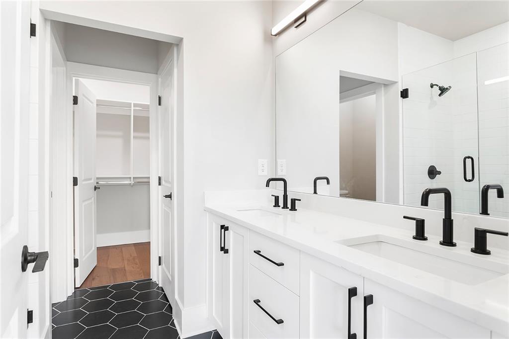 7150 Summit Place Alpharetta, GA 30009 - Photo 16 of 33 a bathroom with a sink and a mirror