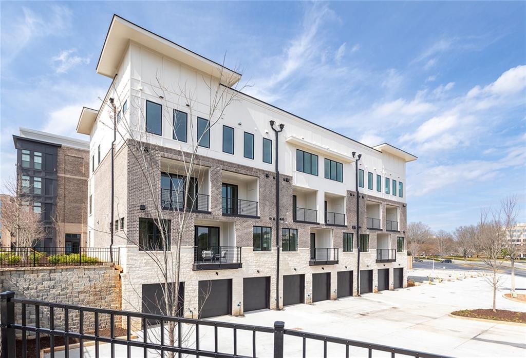 7150 Summit Place Alpharetta, GA 30009 - Photo 2 of 33 a front view of a building with a street