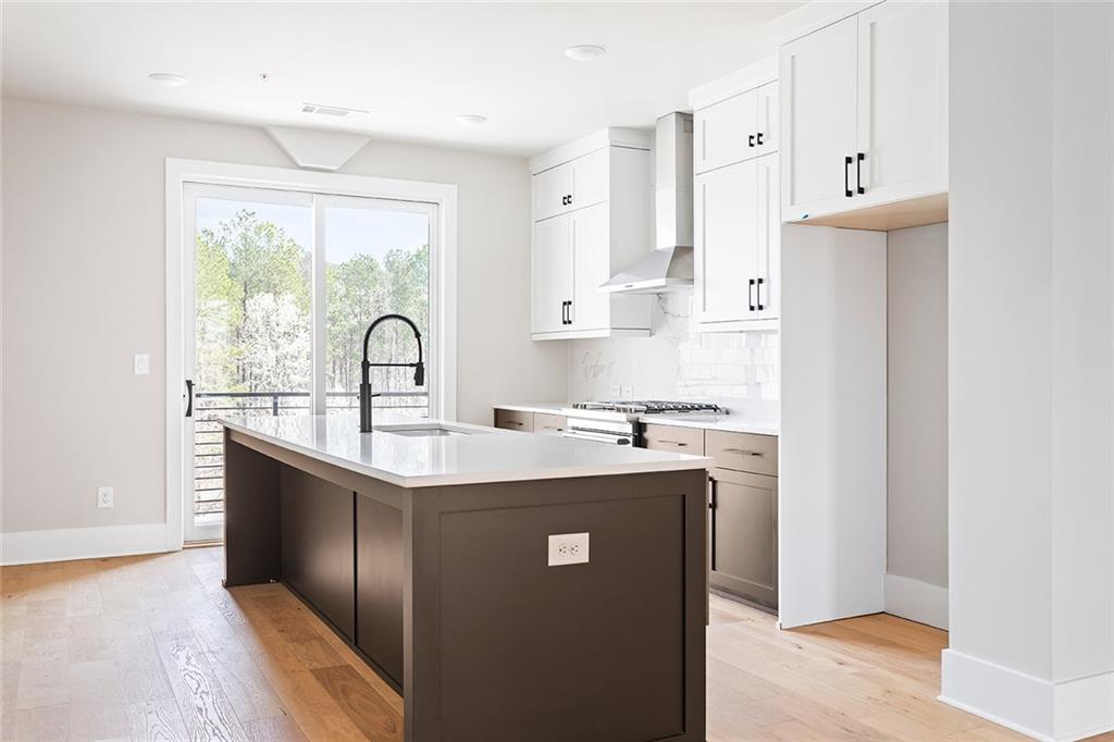7150 Summit Place Alpharetta, GA 30009 - Photo 4 of 33 a kitchen with stainless steel appliances granite countertop a sink stove and refrigerator