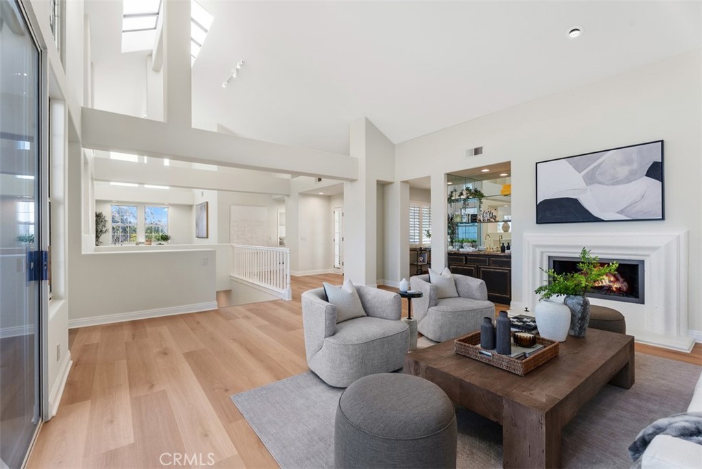 22 Delphinus Irvine, CA 92603 - Photo 12 of 42 a living room with furniture and a fireplace