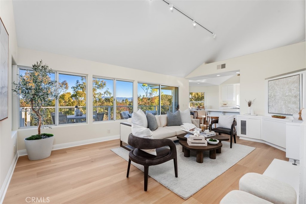 22 Delphinus Irvine, CA 92603 - Photo 15 of 42 a living room with furniture and a potted plant