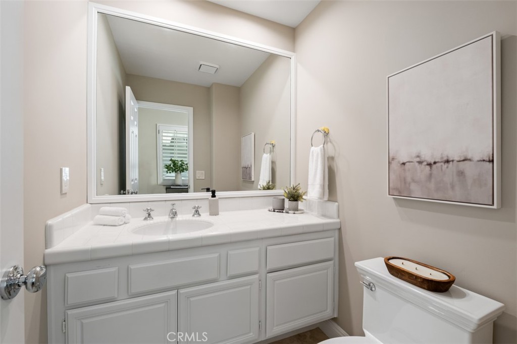 22 Delphinus Irvine, CA 92603 - Photo 30 of 42 a bathroom with a sink and a mirror