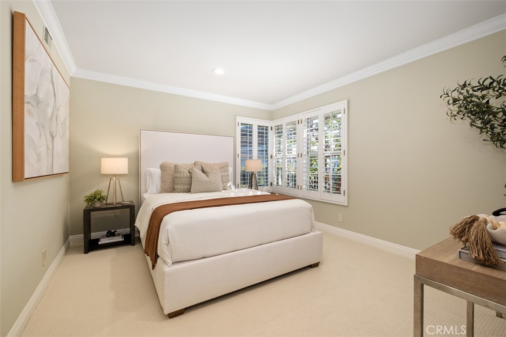 22 Delphinus Irvine, CA 92603 - Photo 31 of 42 a spacious bedroom with a bed and window