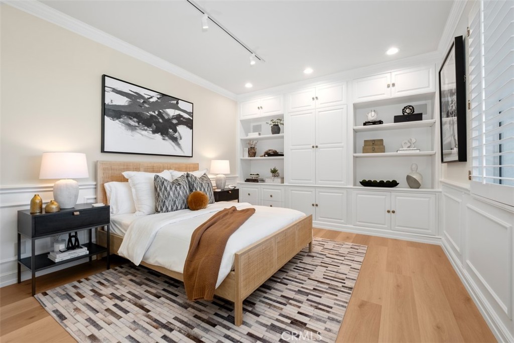 22 Delphinus Irvine, CA 92603 - Photo 37 of 42 a spacious bedroom with a bed and a lamp