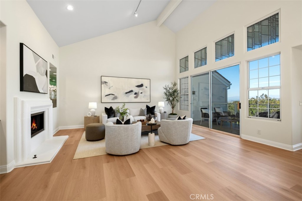22 Delphinus Irvine, CA 92603 - Photo 7 of 42 a living room with fireplace furniture and a window