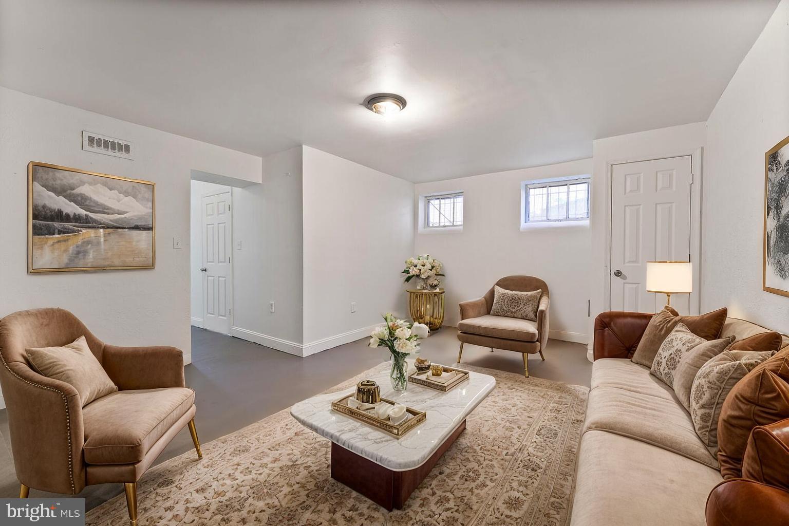 212 Division Avenue Northeast Washington, DC 20019 - Photo 11 of 21 a living room with furniture and a window